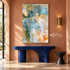 Aqua Fan Leaves with Gold Edges Wall Art shown above a blue console on a terracotta wall.