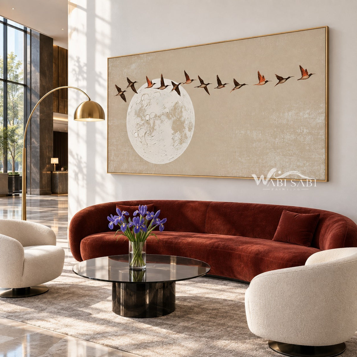 Birds Above a Pale Moon Painting shown in a living room with a sofa.