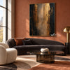 Black and Bronze Vertical Abstract Wall Art shown above a dark sofa.