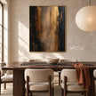 Black and Bronze Vertical Abstract Wall Art shown behind a dining table.