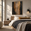 Black and Bronze Vertical Abstract Wall Art shown above a bed with pale bedding.