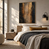 Black and Bronze Vertical Abstract Wall Art shown above a bed with pale bedding.