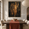 Black and Gold Color Streak Abstract Wall Art shown behind a dining table.