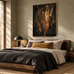 Black and Gold Color Streak Abstract Wall Art shown above a bed with a dark throw.