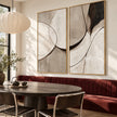 Black Arc and Gray Shape Diptych Wall Art shown behind a dining table and red bench.