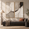 Black Arc and Gray Shape Diptych Wall Art shown above a dark sofa.