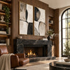 Black Curved Shapes on Cream Diptych Wall Art shown above a fireplace.