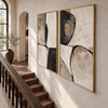 Black Curved Shapes on Cream Diptych Wall Art shown beside a staircase.