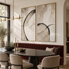 Black Loop and Fine Arc Diptych Wall Art shown behind a dining table.