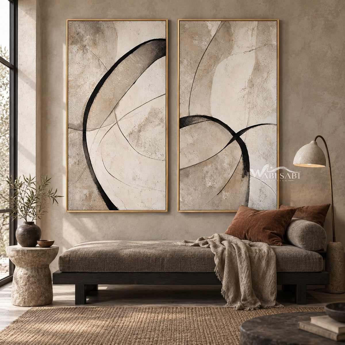 Black Loop and Fine Arc Diptych Wall Art shown above a low sofa.