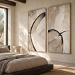 Black Loop and Fine Arc Diptych Wall Art shown above a bed.