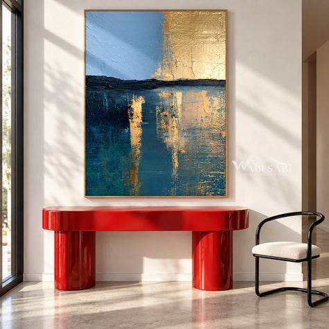 Blue and Gold Tone Horizon Canvas Painting shown above a console.
