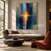 Blue and Orange Brushstroke Abstract Painting shown above a dark sofa.