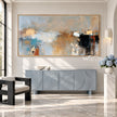 Blue Gray and Black Block Abstract Painting shown above a console.