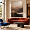 Brown Horizon with Broken White Reflections shown above an orange sofa.