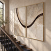 Brown Sweeping Arc Diptych Wall Art shown beside a staircase.
