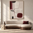 Burgundy Blocks and Oval Line Painting shown in a living room with a sofa.