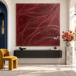 Burgundy Curved Line Abstract Painting shown above a console.