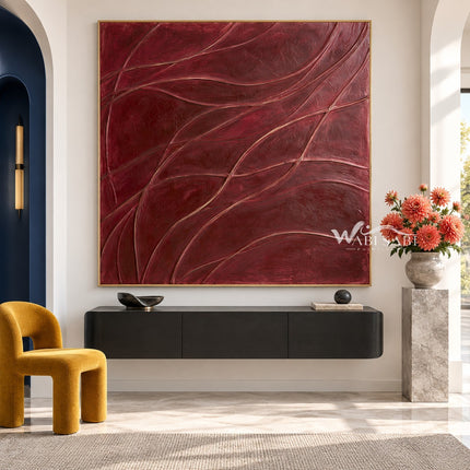 Burgundy Curved Line Abstract Painting shown above a console.