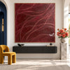 Burgundy Curved Line Abstract Painting shown above a console.