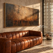 Burnished Dusk Wide Abstract Art shown above a sofa.