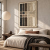 Charcoal and Cream Bar Grid Wall Art shown above a bed with a dark throw.