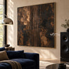 Copper and Charcoal Abstract with Center Stripes shown beside a dark blue sofa.