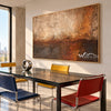 Copper Haze Abstract Canvas Art shown in a dining area.