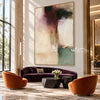 Cream Abstract Painting with Burgundy and Green Blocks shown in a living room with a sofa.