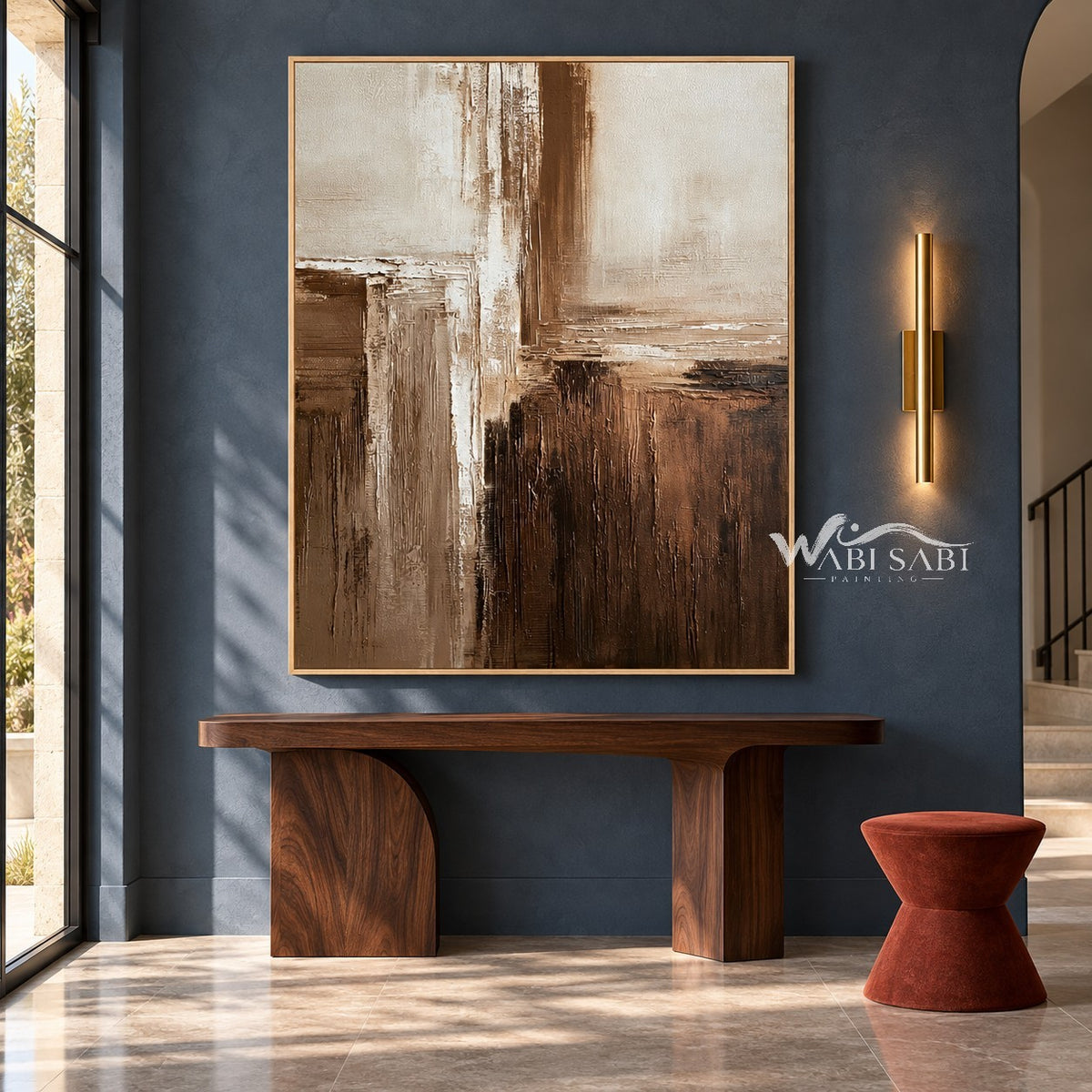 Cream and Brown Intersecting Blocks Wall Art shown above a wood console on a blue wall.