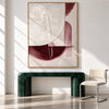 Cream and Burgundy Half Circle Painting shown above a console.