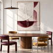 Cream and Burgundy Half Circle Painting shown in a dining area.