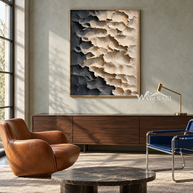Cream and Charcoal Layered Forms Wall Art shown above a wood cabinet between lounge chairs.