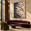 Cream and Charcoal Layered Forms Wall Art shown above a burgundy sofa.