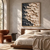 Cream and Charcoal Layered Forms Wall Art shown above a bed with neutral bedding.