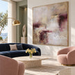 Cream and Plum Weathered Abstract Painting shown in a living room with a sofa.