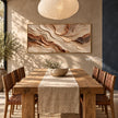 Cream and Rust Contour Panorama Wall Art shown behind a dining table.