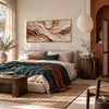 Cream and Rust Contour Panorama Wall Art shown above a bed with a green throw.