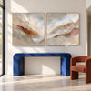 Cream and Rust Mountain Ridge Diptych shown above a console.