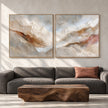 Cream and Rust Mountain Ridge Diptych shown in a living room with a sofa.