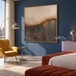 Cream Circles and Charcoal Line Abstract Wall Art shown above a bed beside a yellow chair.