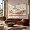 Cream Mountain Panorama with Ochre Ridges shown above a burgundy sofa.