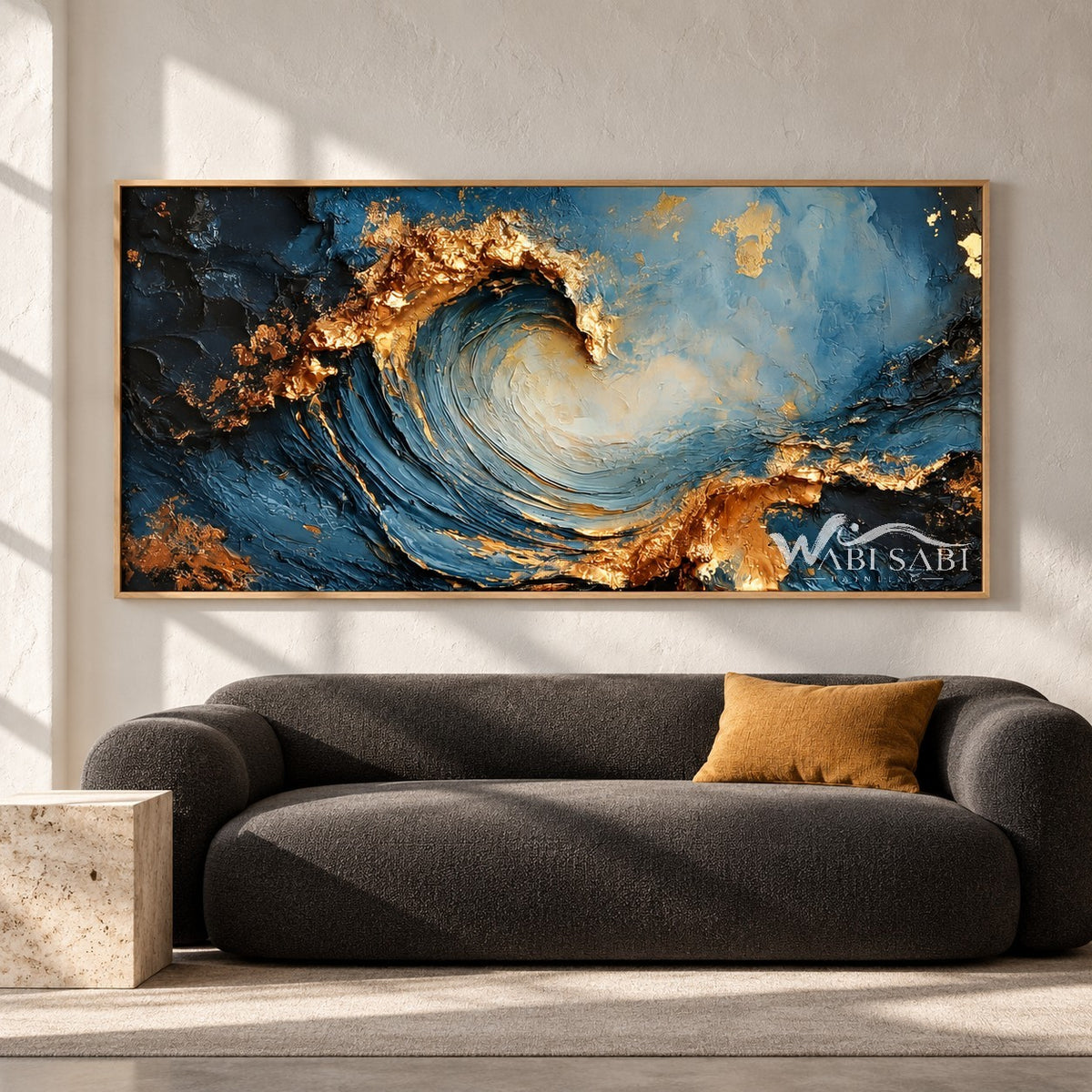 Curling Blue Wave with Gold Tone Crests Painting shown in a living room with a sofa.