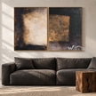 Dark Rectangle Diptych with Gold Tone Accent shown in a living room with a sofa.
