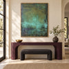 Deep Green Mottled Abstract Painting shown above a console.