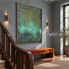 Deep Green Mottled Abstract Painting shown beside a staircase.