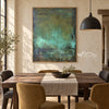 Deep Green Mottled Abstract Painting shown in a dining area.