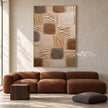 Earth Tone Blocks with Diagonal Marks Painting shown in a living room with a sofa.