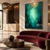 Emerald Abstract Wall Art with a Pale Center shown above a burgundy sofa.