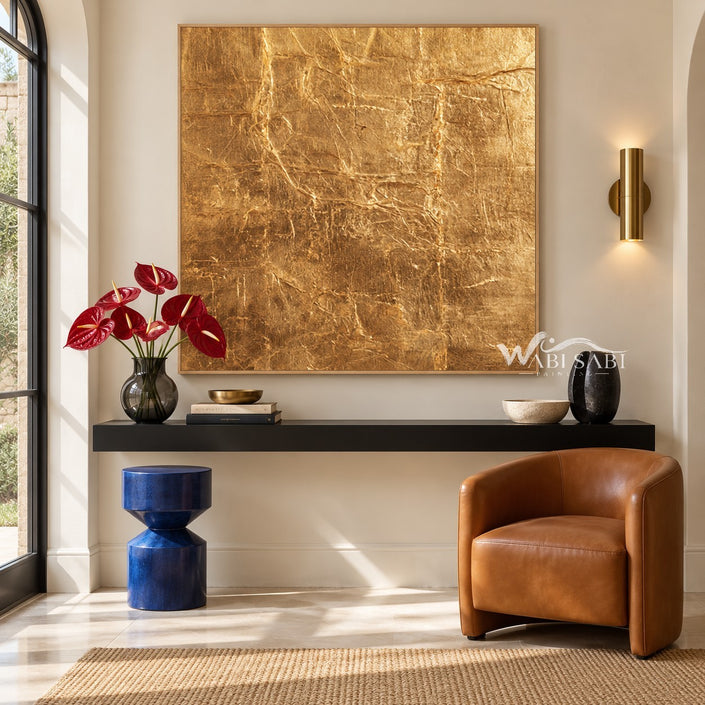 Gold Tone Creased Surface Abstract Painting shown above a console.